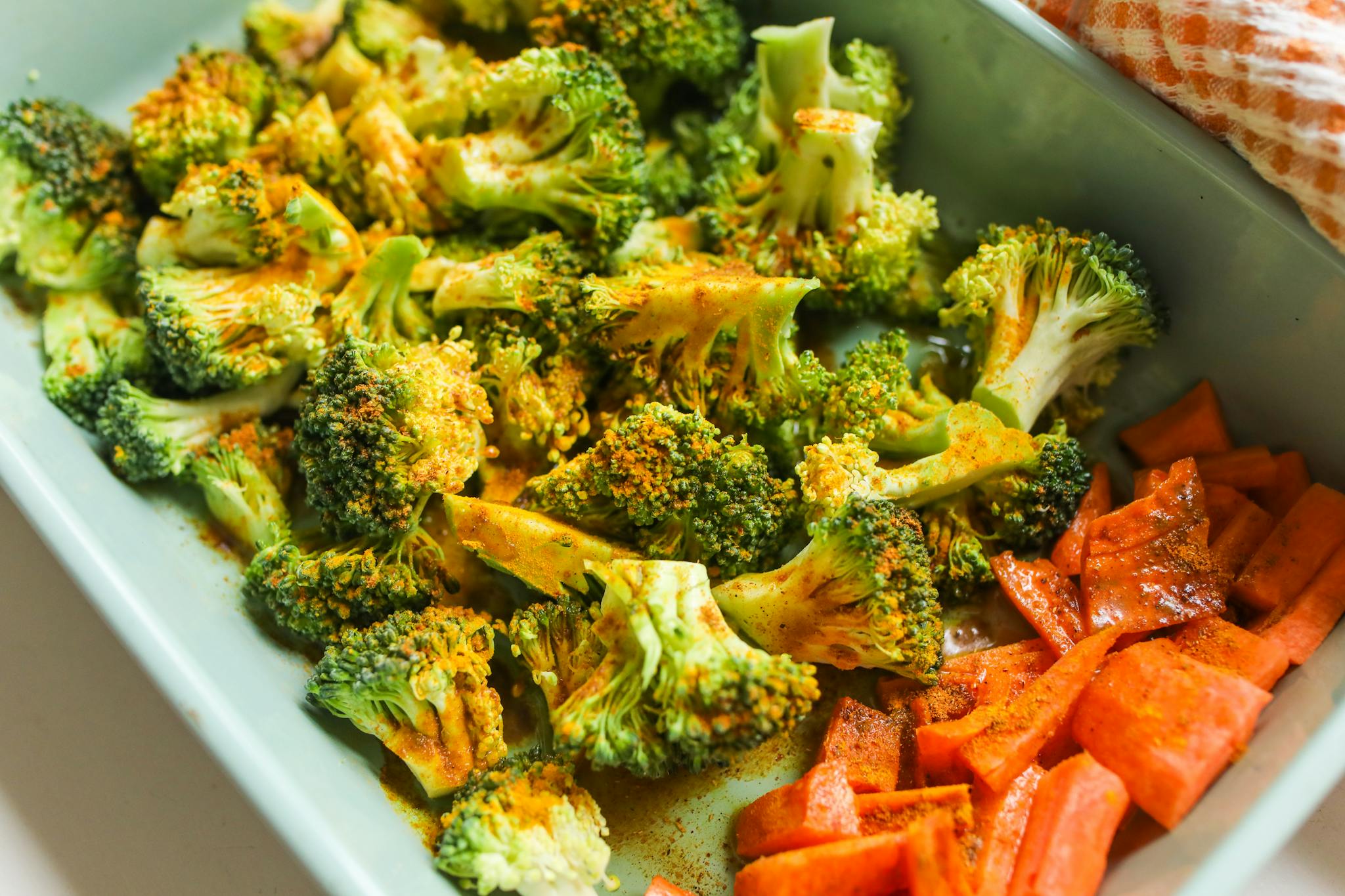 A delightful and vibrant roasted broccoli and carrots dish seasoned to perfection, ideal for health enthusiasts.